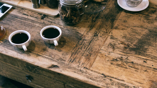 reclaimed hardwood table with espresso cups